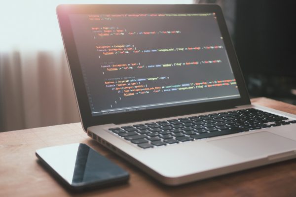 Computer code on laptop (web developing)