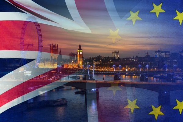 BREXIT conceptual image of London image and UK and EU flags ove