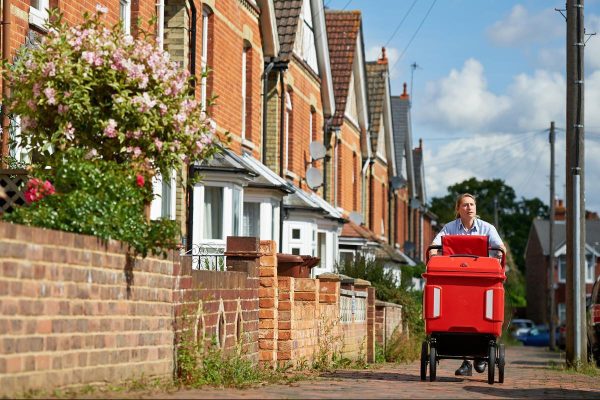 Royal-mail-Postie-with-a-Delivery-Trolley