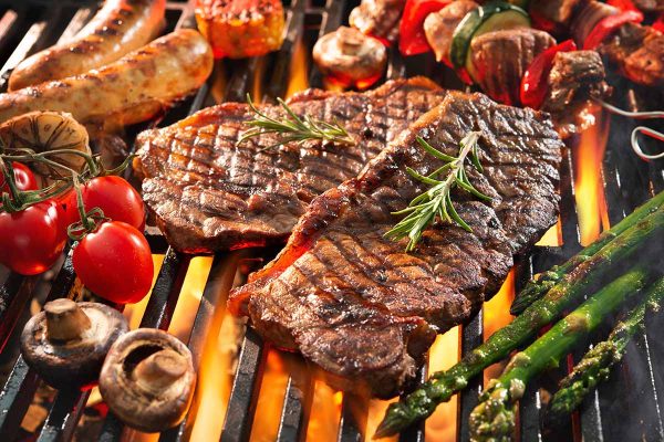 Assorted,Delicious,Grilled,Meat,With,Vegetables,Sizzling,Over,The,Coals