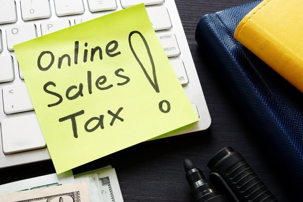 Online,Sales,Tax,On,A,Keyboard,And,Money.